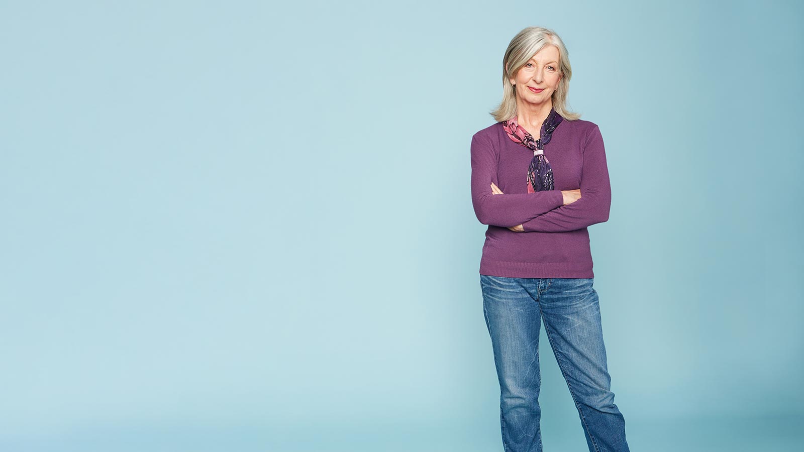 Woman standing with her arms crossed.